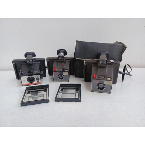 239 - Three Polaroid instant cameras, two Super Swinger land cameras and one Colorpack 80