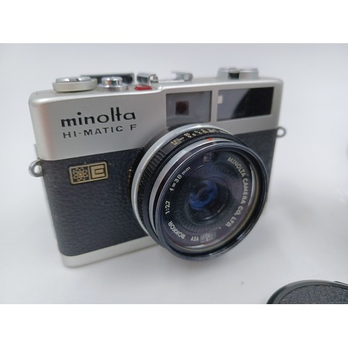 234 - Four items, one Minolta XD7 35mm SLR camera fitted with MC Rokkor-PG 1:1.4 f=50mm lens, one Minolta ... 