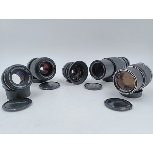 241 - Five Olympus OM system lenses, one S Zuiko 100-200mm 1:5 auto-zoom, one E.Zuiko f=135mm 1:3.5 Auto-T... 