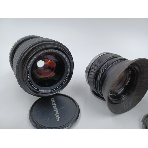 241 - Five Olympus OM system lenses, one S Zuiko 100-200mm 1:5 auto-zoom, one E.Zuiko f=135mm 1:3.5 Auto-T... 