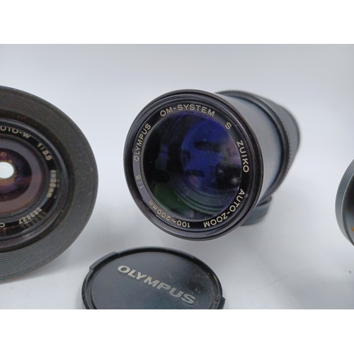 241 - Five Olympus OM system lenses, one S Zuiko 100-200mm 1:5 auto-zoom, one E.Zuiko f=135mm 1:3.5 Auto-T... 