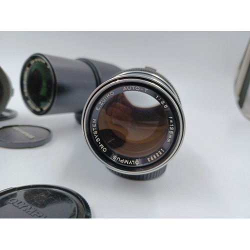 241 - Five Olympus OM system lenses, one S Zuiko 100-200mm 1:5 auto-zoom, one E.Zuiko f=135mm 1:3.5 Auto-T... 