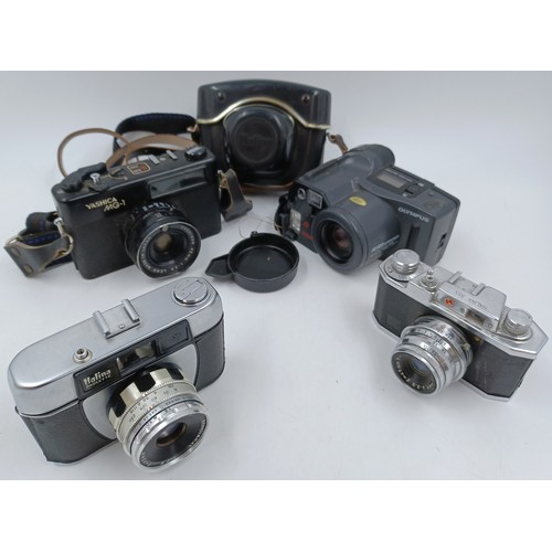 242 - Four 35mm cameras, one Haking Halina 35X viewfinder, one cased Haking Halina Paulette viewfinder, on... 