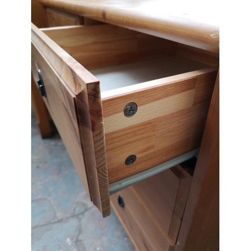 104 - A modern pine chest of two short over two long drawers - approx. 80cm high x 95cm wide x 49cm deep