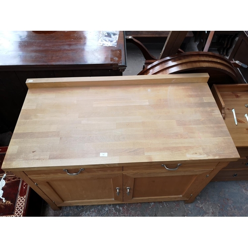 107 - A modern solid beech sideboard with two upper drawers and two lower cupboard doors - approx. 95cm hi... 