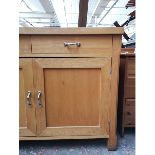 107 - A modern solid beech sideboard with two upper drawers and two lower cupboard doors - approx. 95cm hi... 