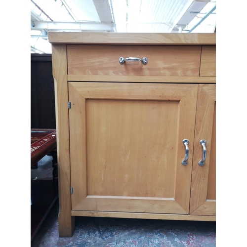 107 - A modern solid beech sideboard with two upper drawers and two lower cupboard doors - approx. 95cm hi... 