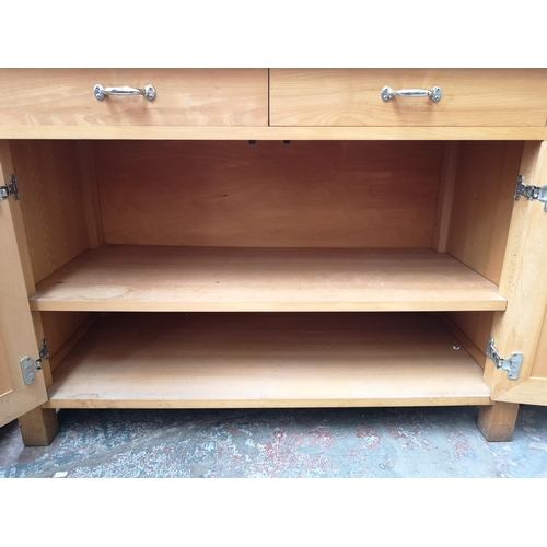 107 - A modern solid beech sideboard with two upper drawers and two lower cupboard doors - approx. 95cm hi... 