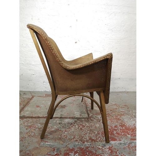 115 - An early/mid 20th century Lloyd Loom style gold painted wicker chair - approx. 82cm high x 63cm wide... 