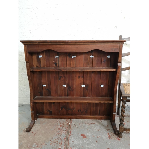 153 - Four pieces of furniture comprising elm Windsor dining chair, pine plate rack and two rattan seated ... 