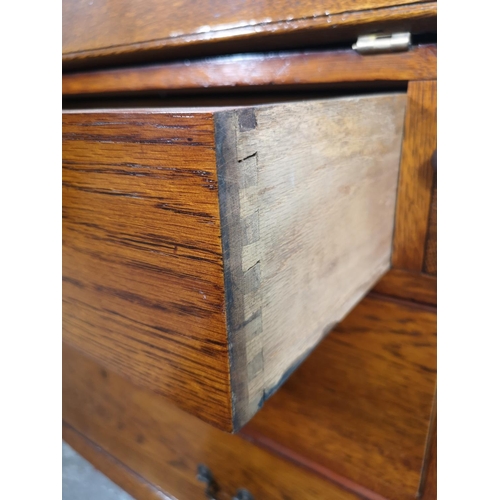 155 - A mid/late 20th century oak bureau with three drawers, fall front and cabriole supports - approx. 10... 