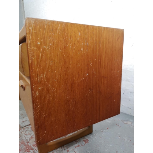 18 - A mid 20th century teak four drawer dressing table - approx. 68cm high x 155cm wide x 41cm deep