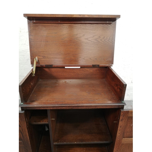 19 - A Jaycee oak linen fold two door cabinet with hinged lid - approx. 88cm high x 74cm wide - 48cm deep