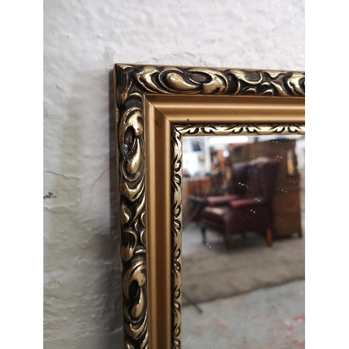 196 - Two modern framed mirrors - largest approx. 138cm wide x 106cm high