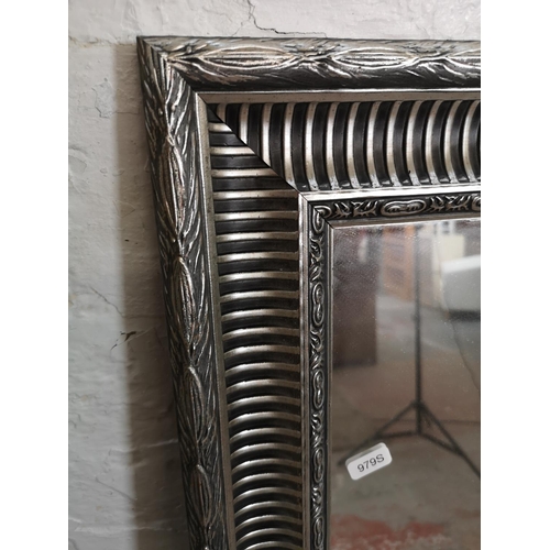 196 - Two modern framed mirrors - largest approx. 138cm wide x 106cm high