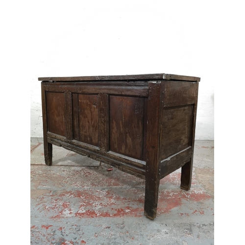 24 - A late 17th century oak three panel coffer - approx. 75cm high x 113cm wide x 50cm deep