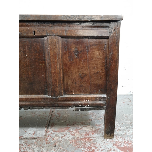 24 - A late 17th century oak three panel coffer - approx. 75cm high x 113cm wide x 50cm deep