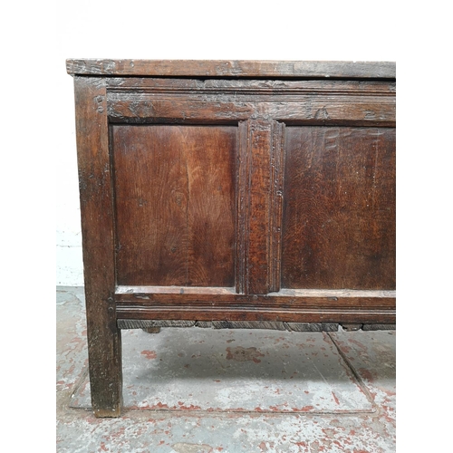 24 - A late 17th century oak three panel coffer - approx. 75cm high x 113cm wide x 50cm deep