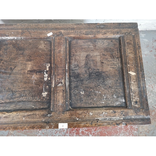 24 - A late 17th century oak three panel coffer - approx. 75cm high x 113cm wide x 50cm deep