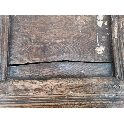 24 - A late 17th century oak three panel coffer - approx. 75cm high x 113cm wide x 50cm deep