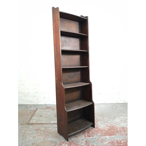 26 - An oak seven tier free standing waterfall bookcase - approx. 163cm high x 47cm wide x 20cm deep