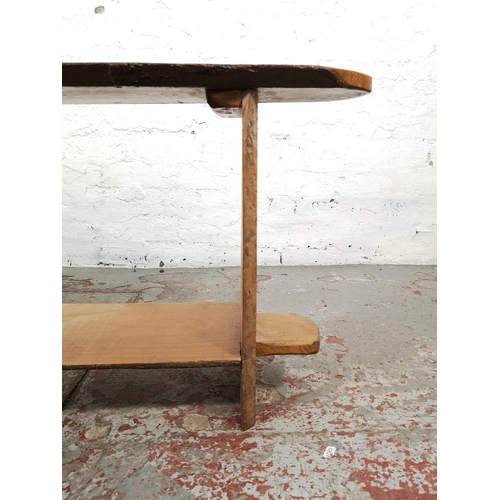 27 - An oak tree slice bench with lower shelf - approx. 50cm high x 117cm wide x 25cm deep