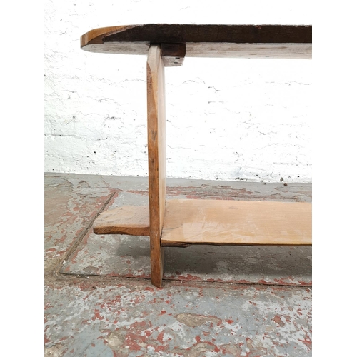 27 - An oak tree slice bench with lower shelf - approx. 50cm high x 117cm wide x 25cm deep