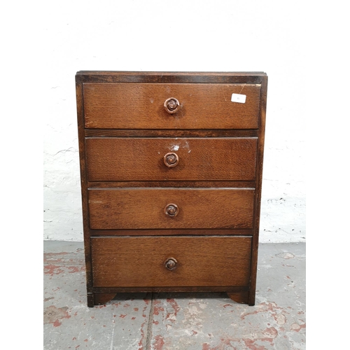 31 - A mid 20th century oak chest of four drawers - approx. 72cm high x 53cm wide x 45cm deep