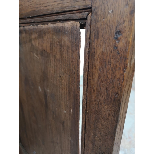 33 - An early 20th century carved oak single door cabinet with upper drawer - approx. 97cm high x 66cm wi... 