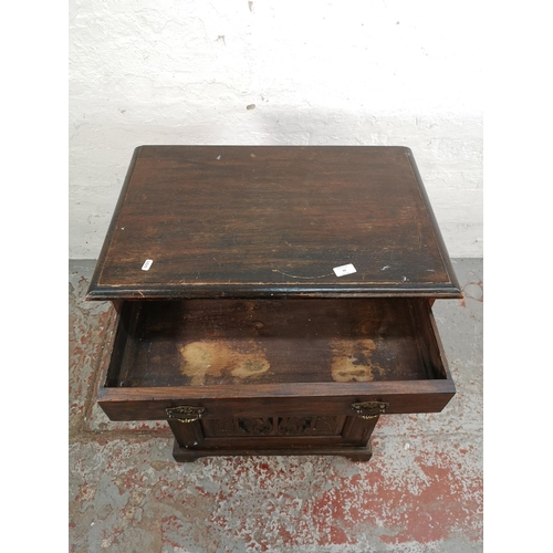 33 - An early 20th century carved oak single door cabinet with upper drawer - approx. 97cm high x 66cm wi... 