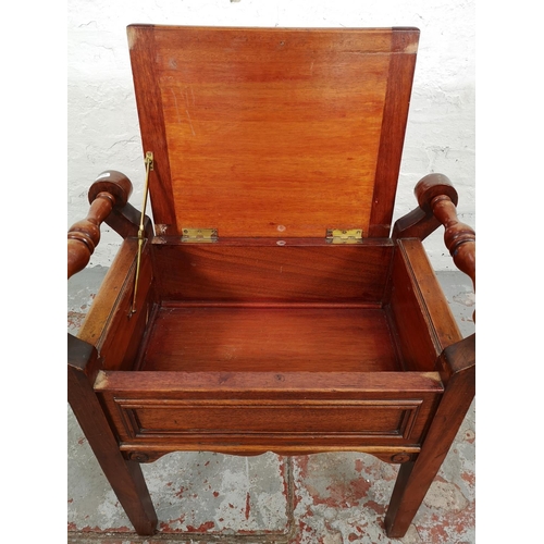 36 - An Edwardian style mahogany twin handled piano stool with cream upholstery - approx. 60cm high x 60c... 