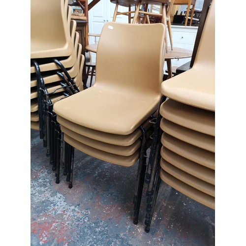 41 - Twenty nine brown plastic and black metal school stacking chairs