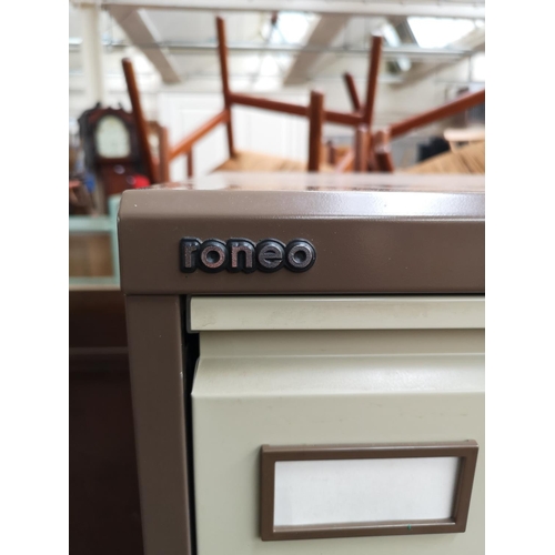 42 - A Roneo brown and cream metal four drawer office filing cabinet - approx. 132cm high x 47cm wide x 6... 