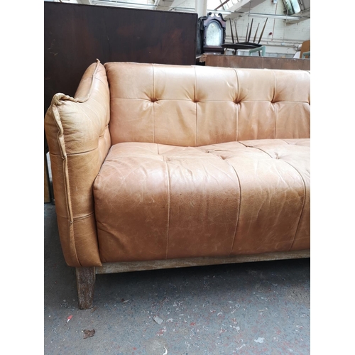 45 - A contemporary brown leather and limed oak three seater sofa - approx. 75cm high x 195cm wide x 80cm... 