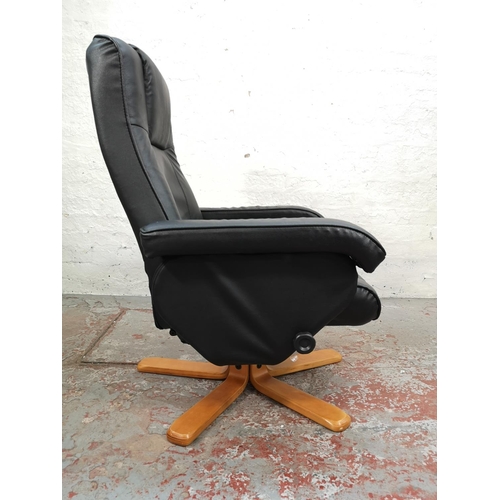 48 - A Stressless style black leather swivel reclining armchair on beech supports - approx. 99cm high x 7... 