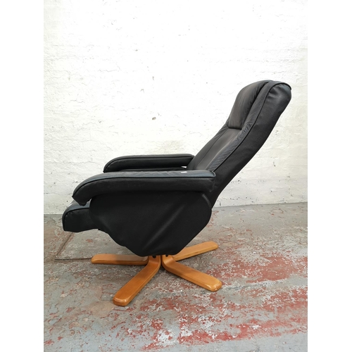 48 - A Stressless style black leather swivel reclining armchair on beech supports - approx. 99cm high x 7... 