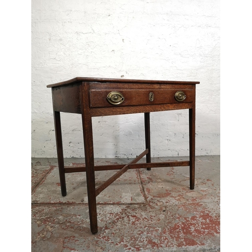 5 - A George III oak rectangular side table with lower X frame stretcher and single drawer - approx. 70c... 