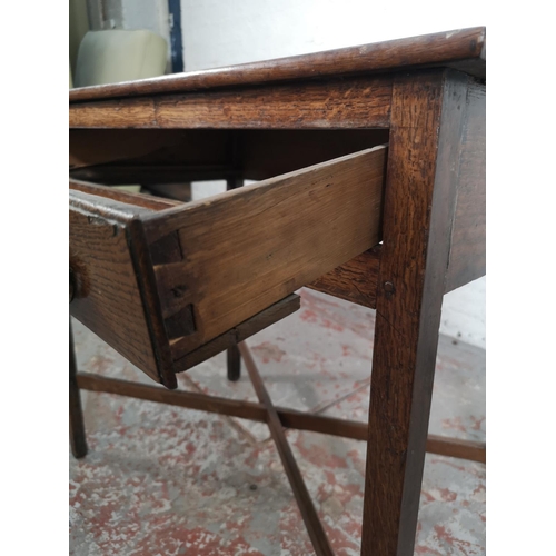 5 - A George III oak rectangular side table with lower X frame stretcher and single drawer - approx. 70c... 