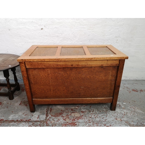 63 - Three pieces of furniture comprising oak swivel top joint occasional table, copper topped coffee tab... 