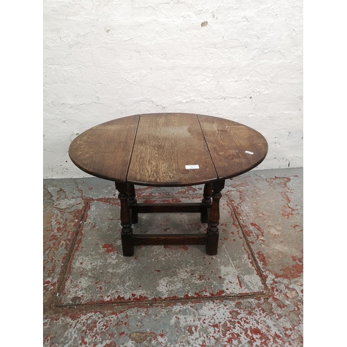 63 - Three pieces of furniture comprising oak swivel top joint occasional table, copper topped coffee tab... 