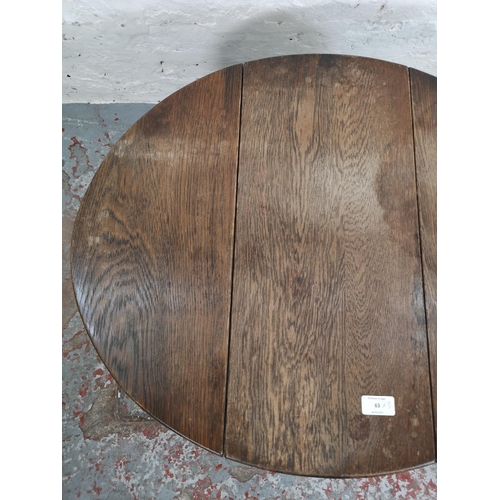 63 - Three pieces of furniture comprising oak swivel top joint occasional table, copper topped coffee tab... 