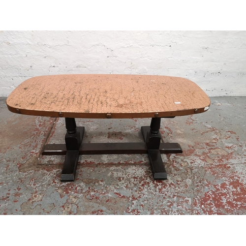 63 - Three pieces of furniture comprising oak swivel top joint occasional table, copper topped coffee tab... 