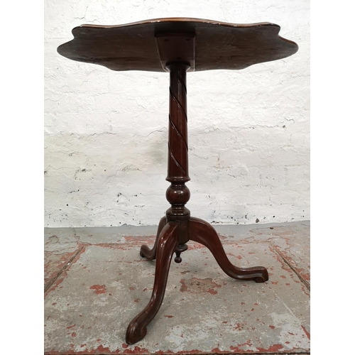 68 - An early 20th century mahogany serpentine side table with tripod pedestal support - approx. 65cm hig... 