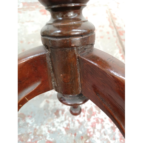 68 - An early 20th century mahogany serpentine side table with tripod pedestal support - approx. 65cm hig... 