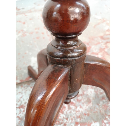 68 - An early 20th century mahogany serpentine side table with tripod pedestal support - approx. 65cm hig... 