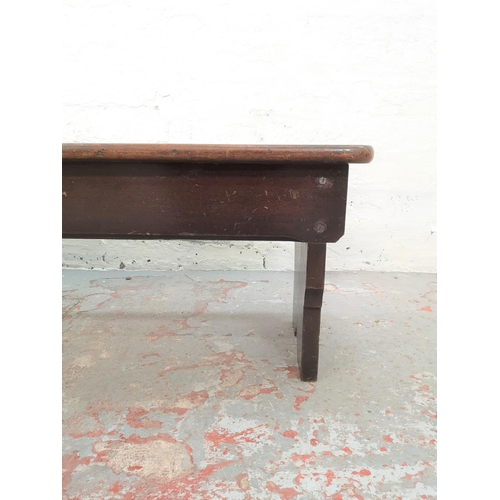 77 - An early 20th century oak bench - approx. 33cm high x 127cm wide x 32cm deep