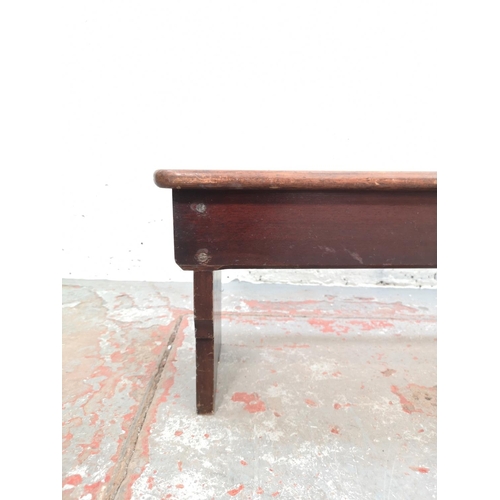 77 - An early 20th century oak bench - approx. 33cm high x 127cm wide x 32cm deep