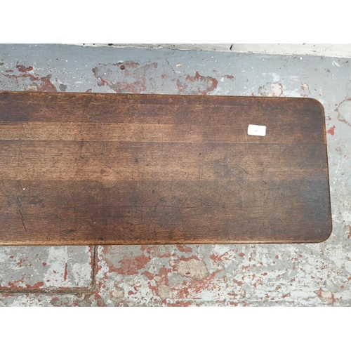 77 - An early 20th century oak bench - approx. 33cm high x 127cm wide x 32cm deep