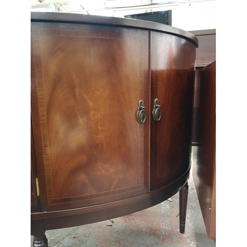 81 - A Strongbow Furniture mahogany bow fronted sideboard with three central drawers and two outer cupboa... 