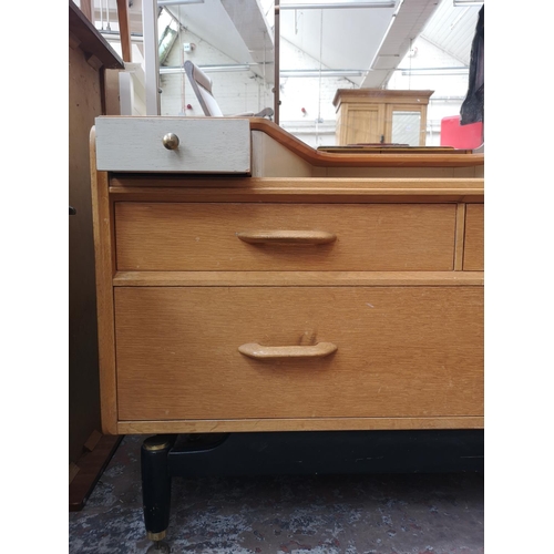 82 - A 1950s G Plan Brandon oak and black lacquered dressing table with upper mirror - approx. 139cm high... 